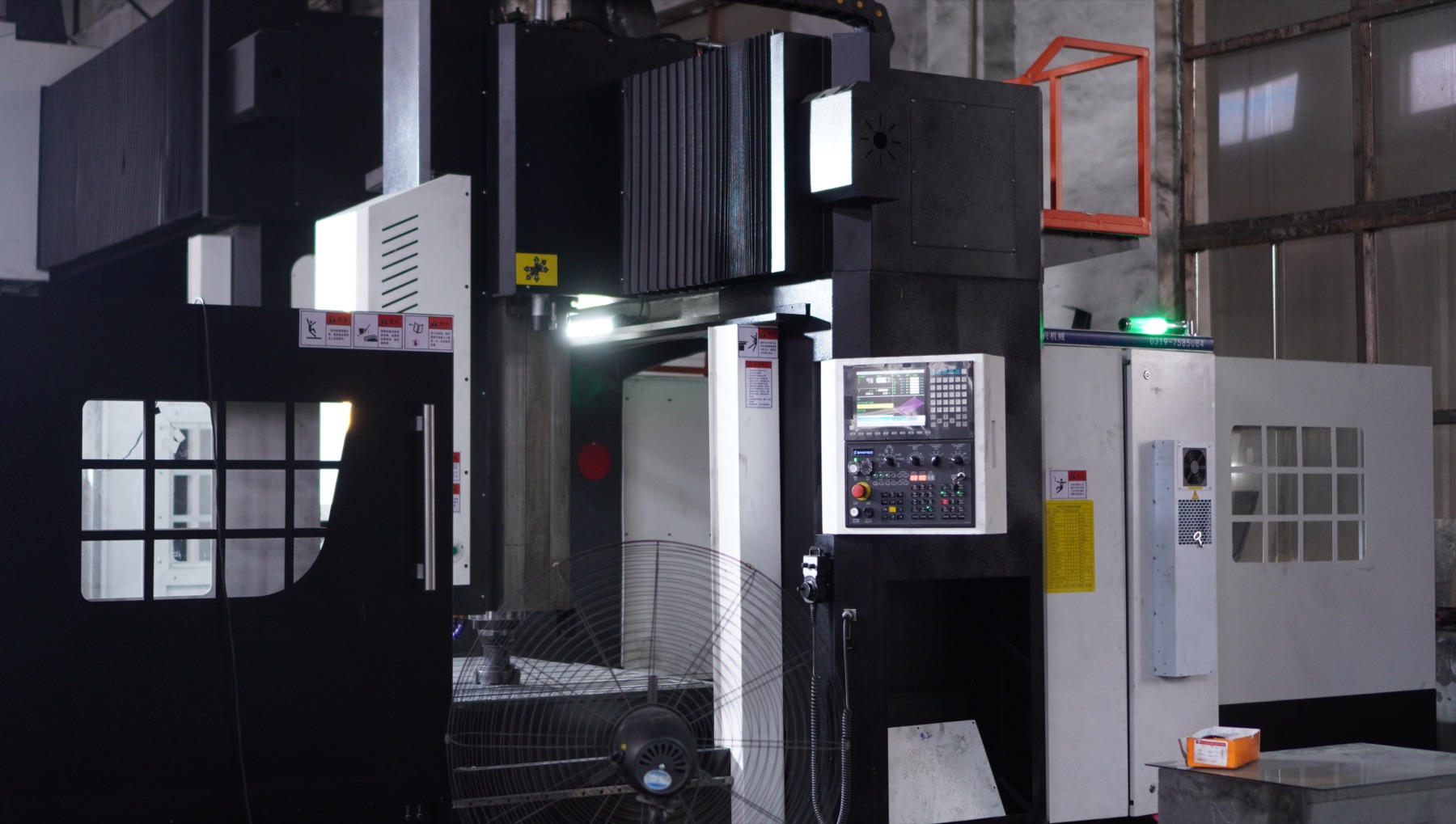 CNC machine control station and spindle area